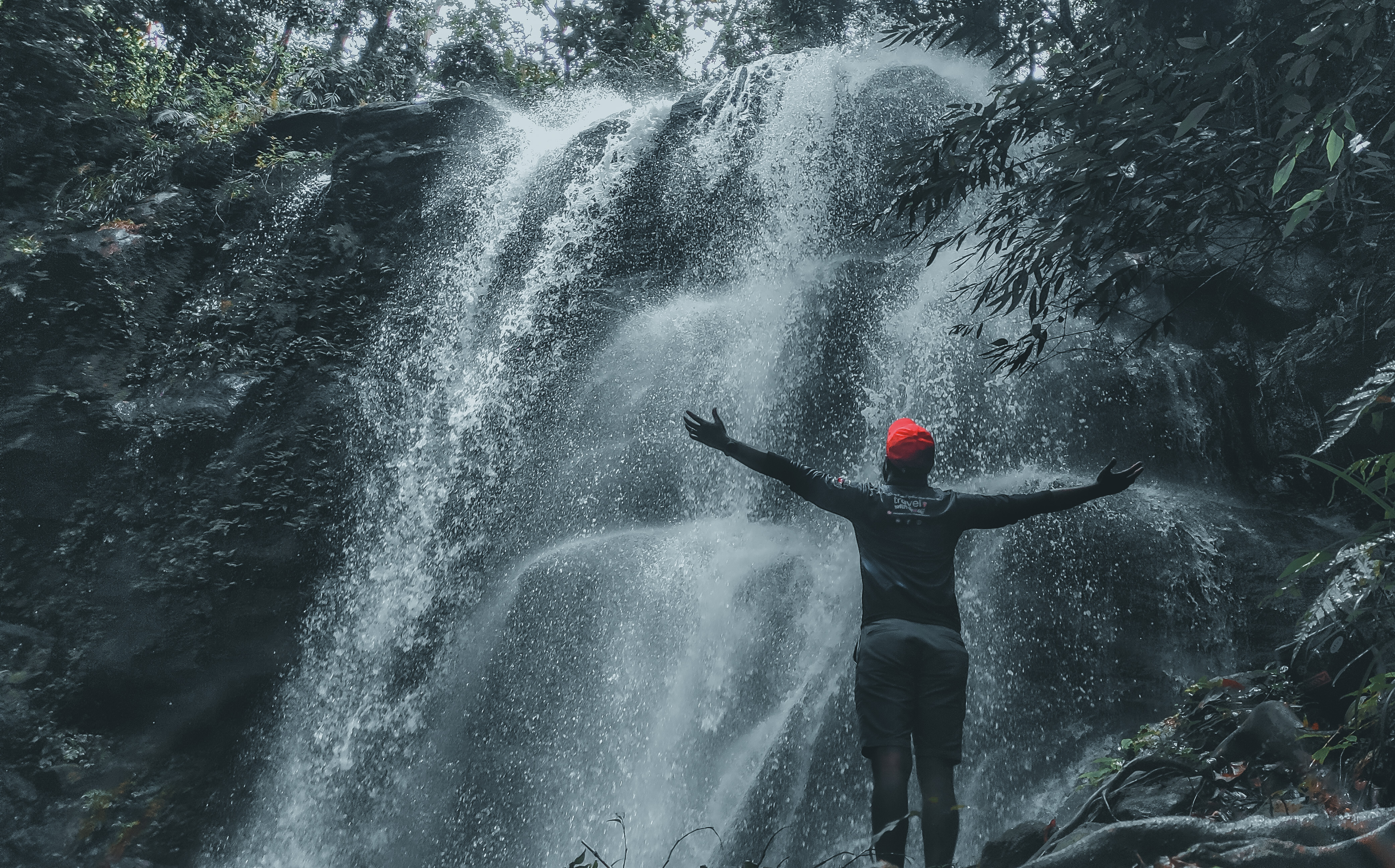 Man infront of a waterfall