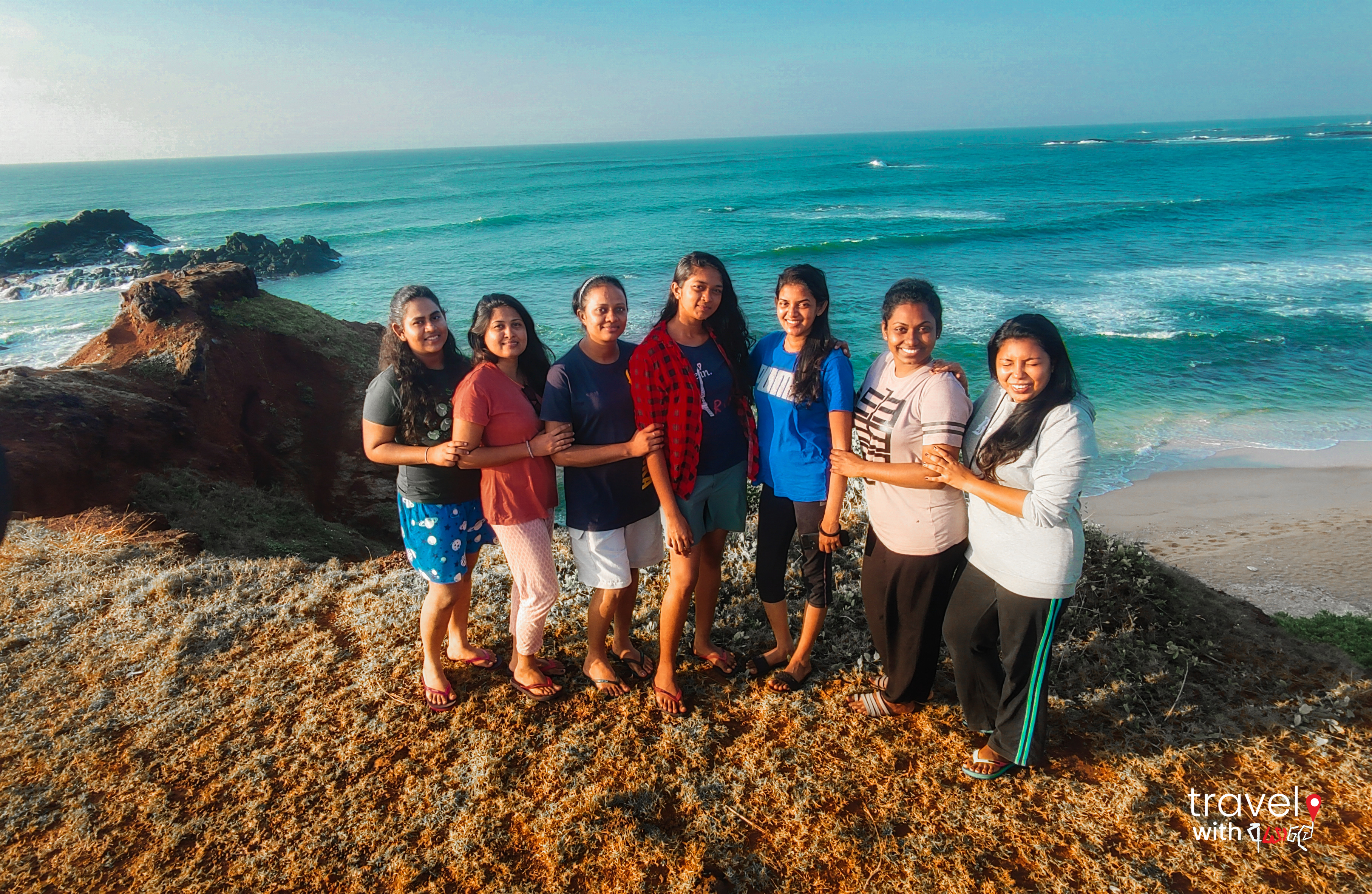 Grils infront of a beautiful beach in sri lanka